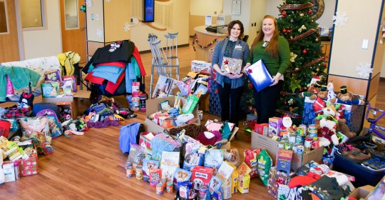 Pictured with the contributed items are (Left to Right) Devin Goldman, Customer Experience and Quality Coordinator, and Catie Brenaman, Community Health Educator, coordinators of the GSHCS 12 Days of Giving campaign, #GSGivesBack.